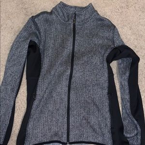 A black and white striped zip up jacket